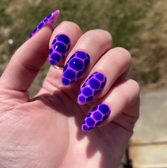 Violet, pink tortoise pattern, glossy almond nails.