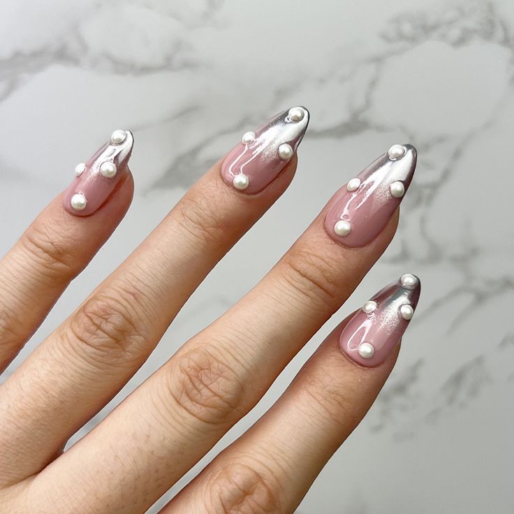 White pearly dews, chromatic almond nails.