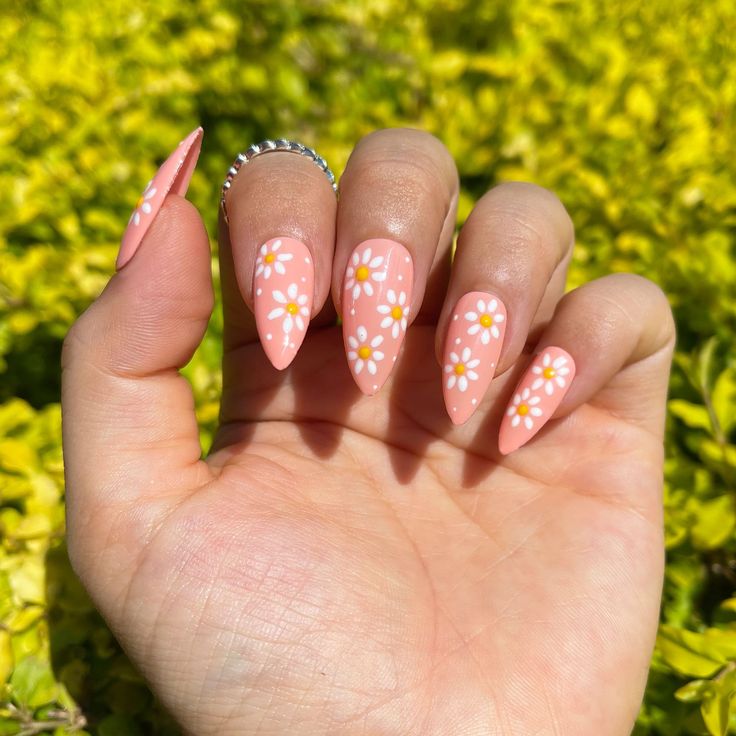 Peach with daisies, light gloss almond nails.