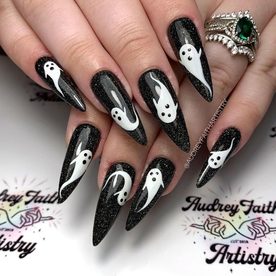 Subtle black glitter with white ghosts.