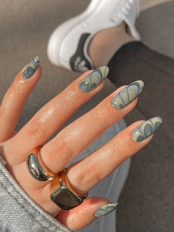 Grey swirls, gradient shades almond nails.