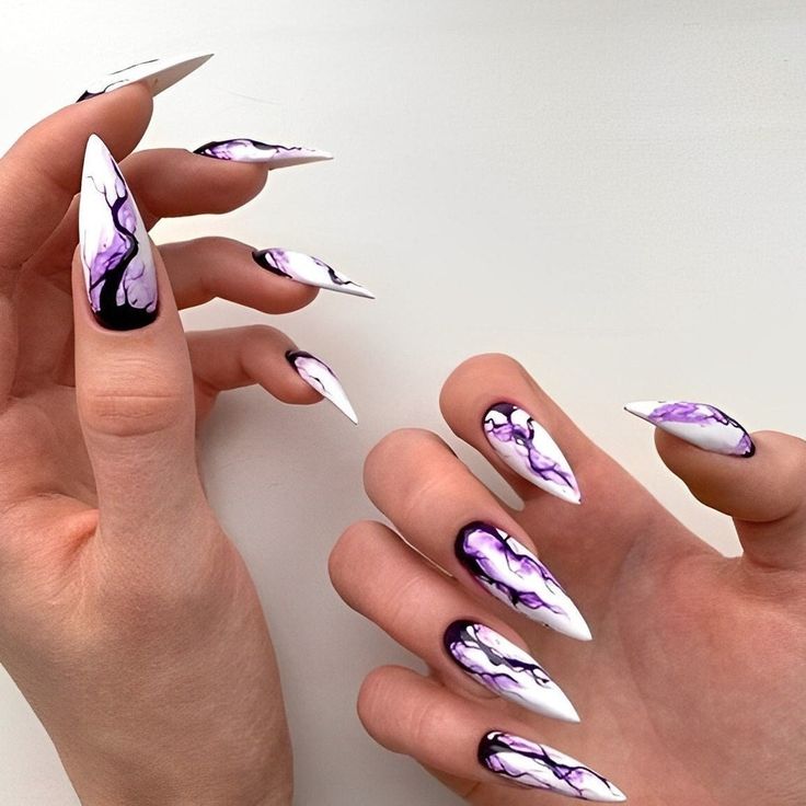 Mysterious garden-themed nails in white and purple.