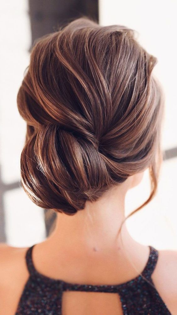 wedding guest hair look inspired side-swept twisted bun