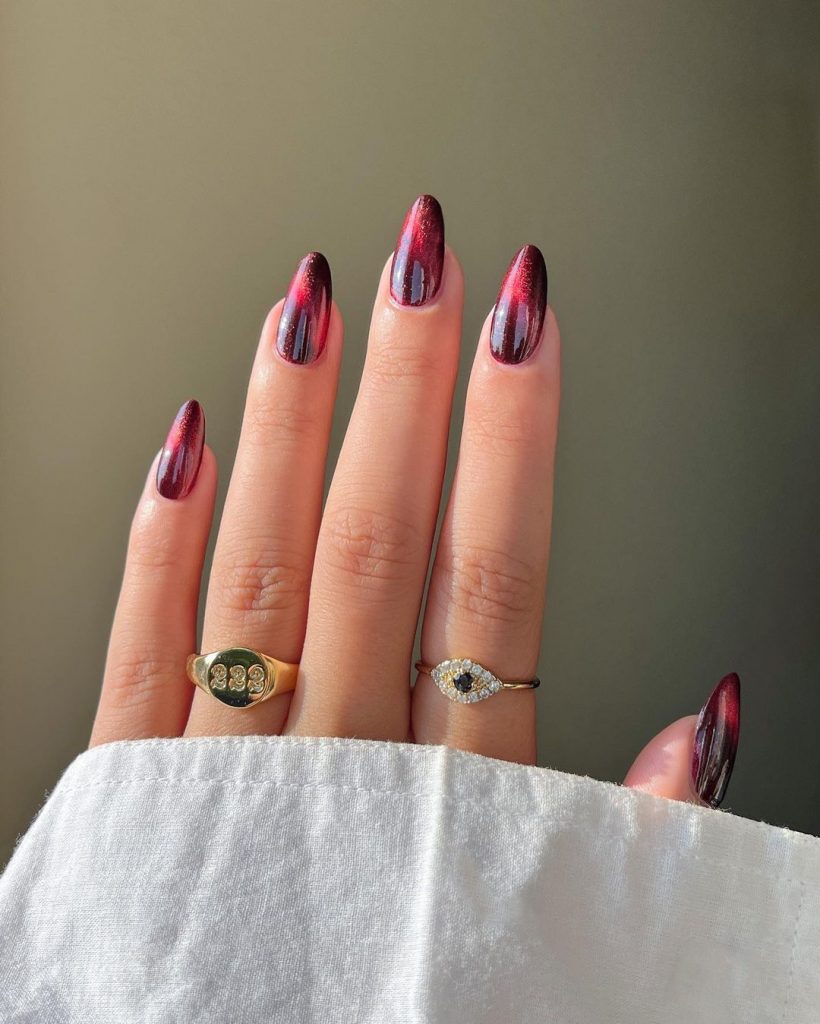 Blood red almond-shaped nails.