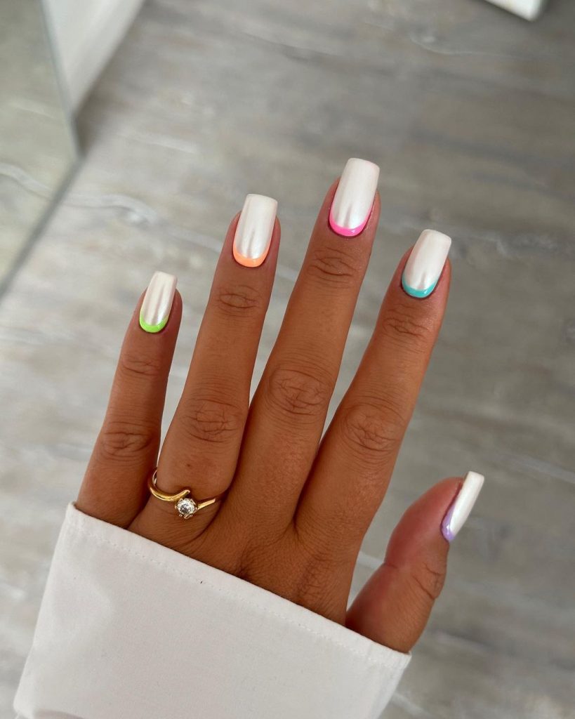 Bright white square nails with colorful cuffs.