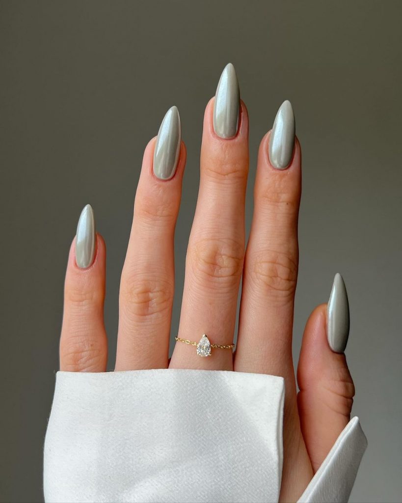Dusty grey pointed almond chrome nails.