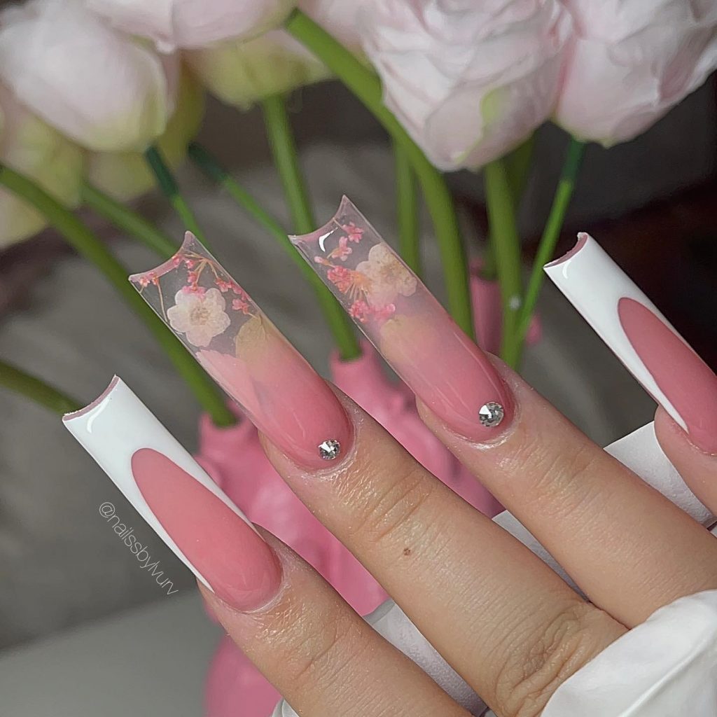 Salmon pink French tip square nails.