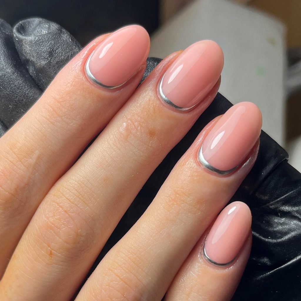 Glossy pinkish nude accents with thin silver cuffs.