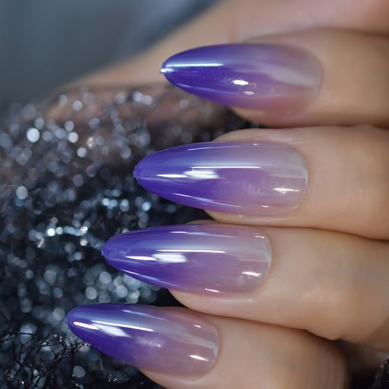 Purple nude ombre almond nails with a glossy finish.