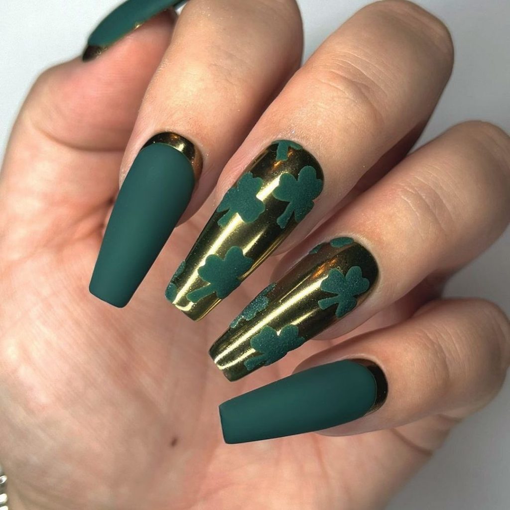 Golden-cuffed matte green jungle nails.