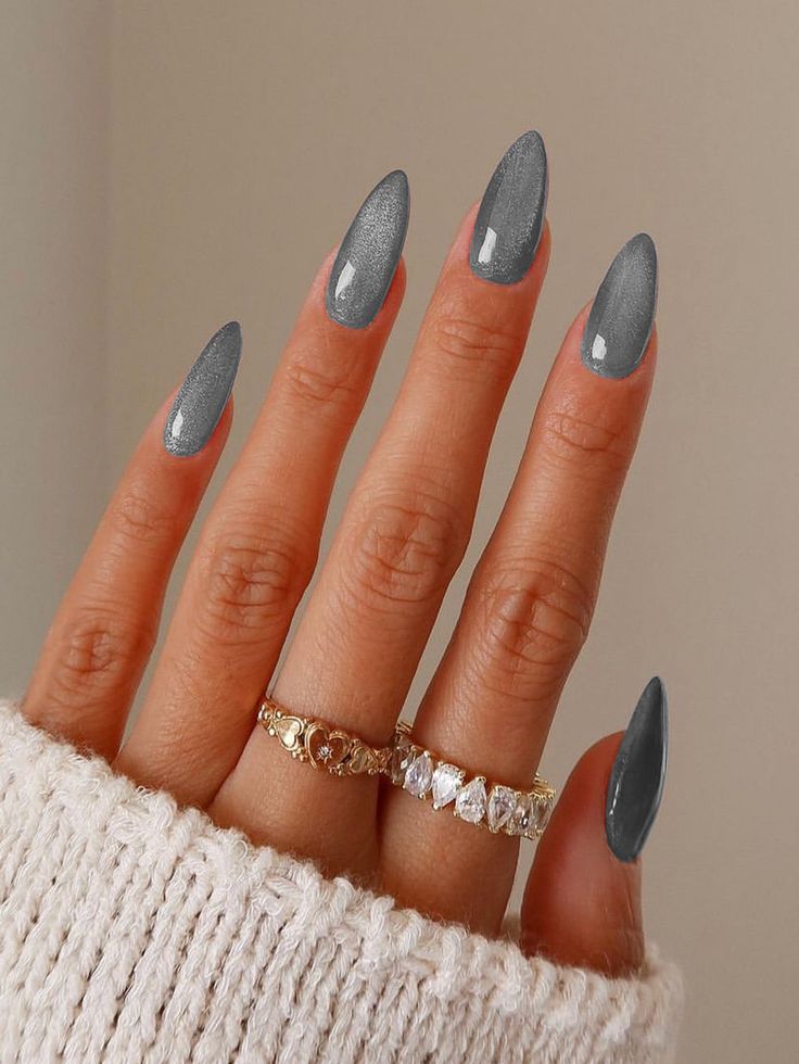 Slate grey cat-eye almond-shaped nails.