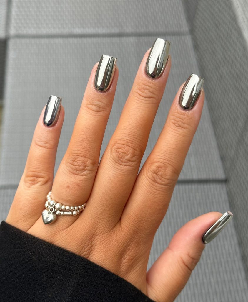 Gleaming metallic silver square nails.