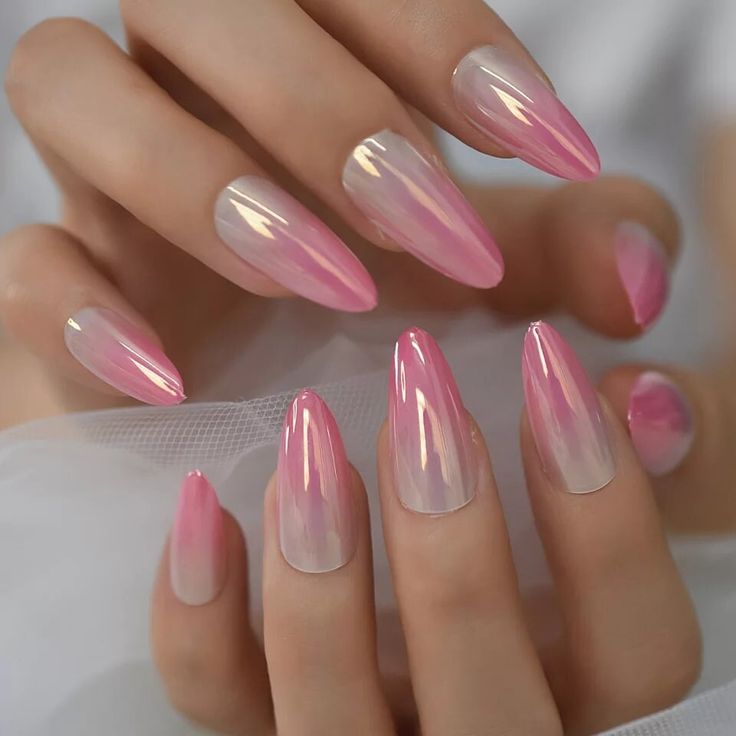 Almond-shaped nails in glossy ombre pink and nude.