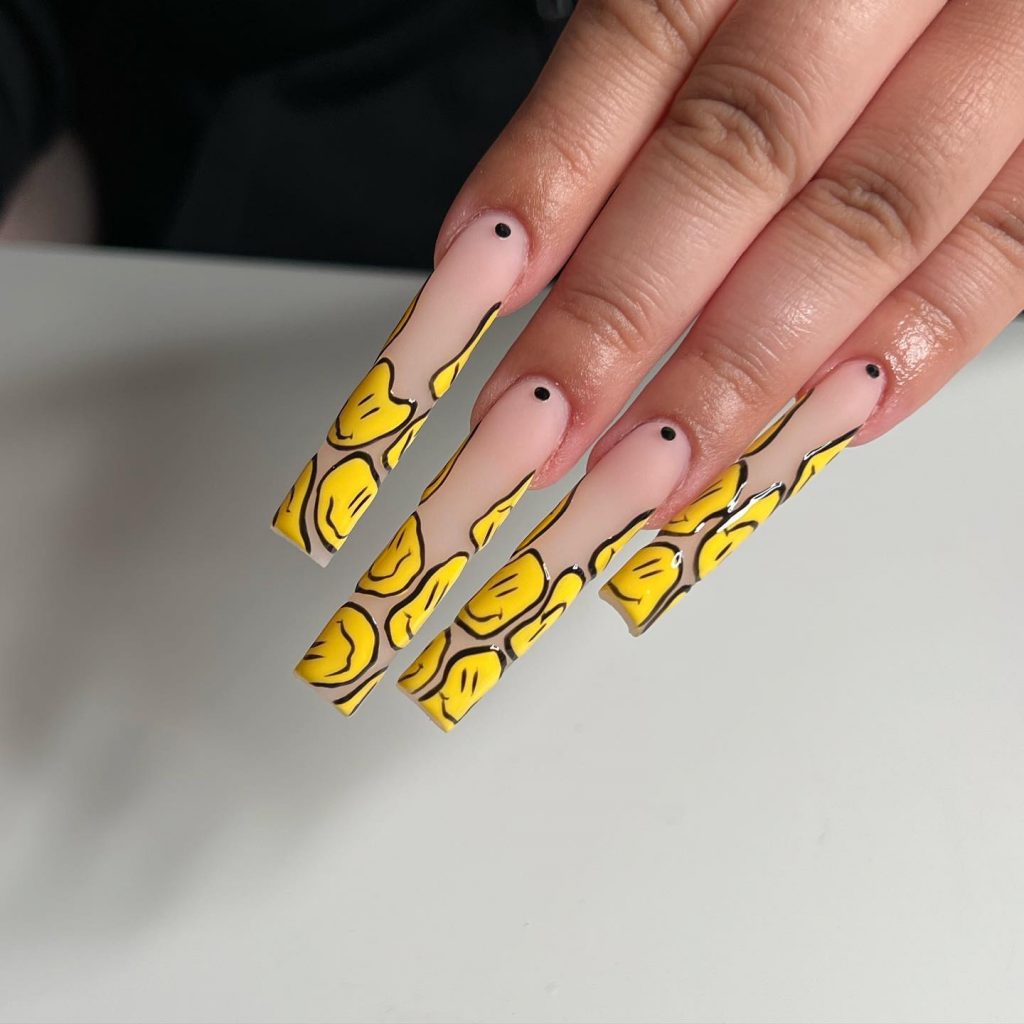 Yellow smiles on a nude matte surface.