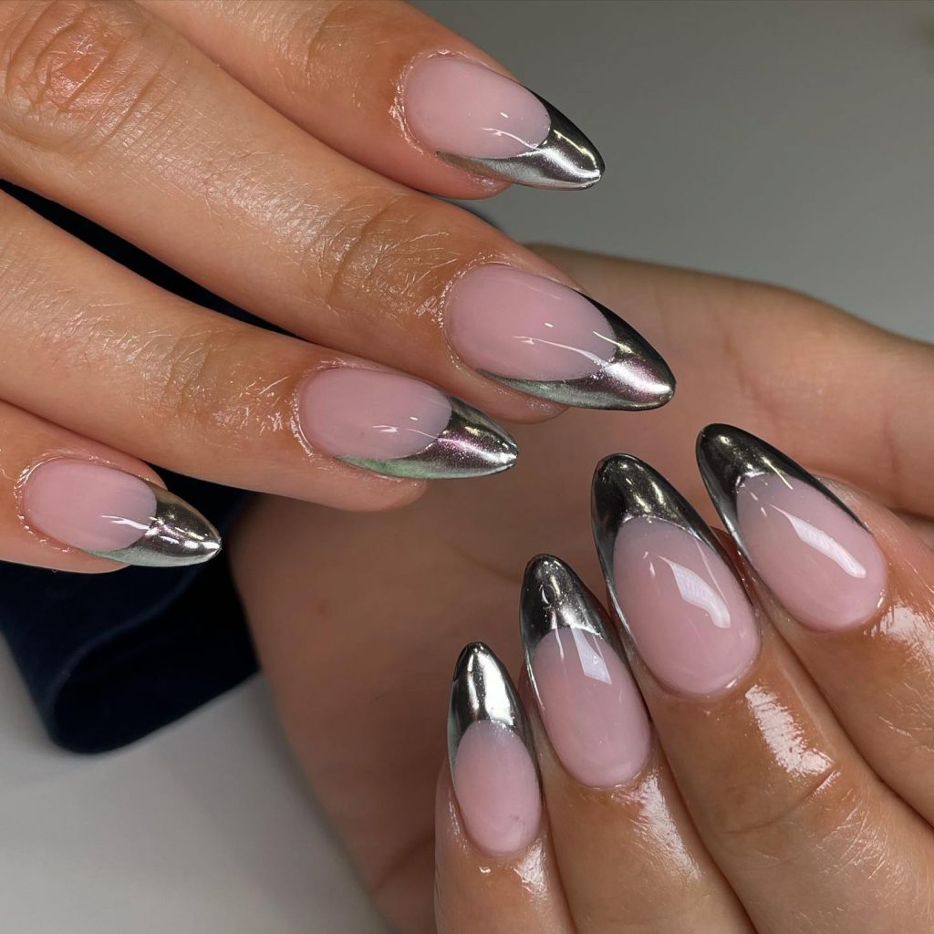 Silver chrome French tips on almonds.