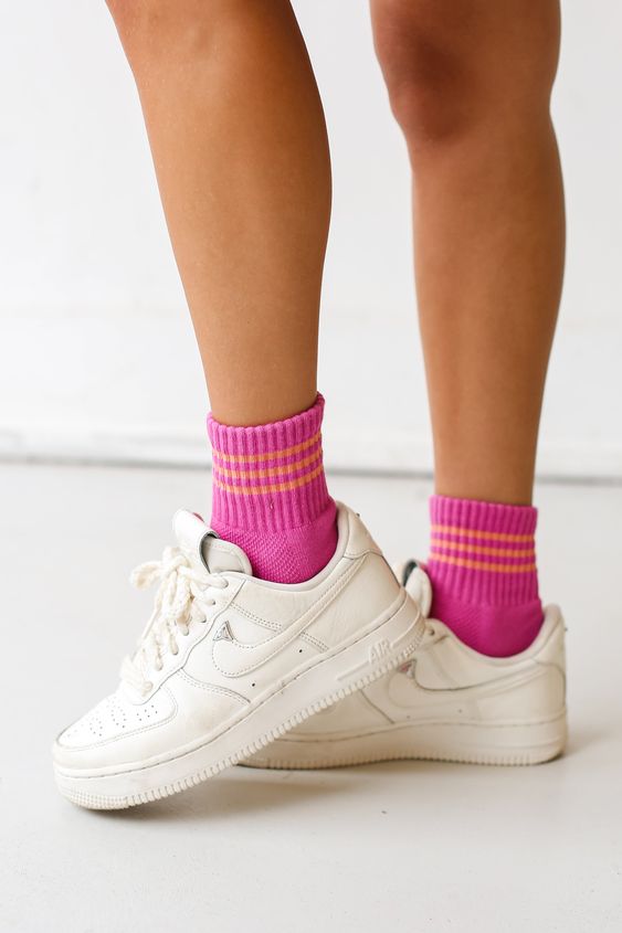 white sneakers paired with colorful socks