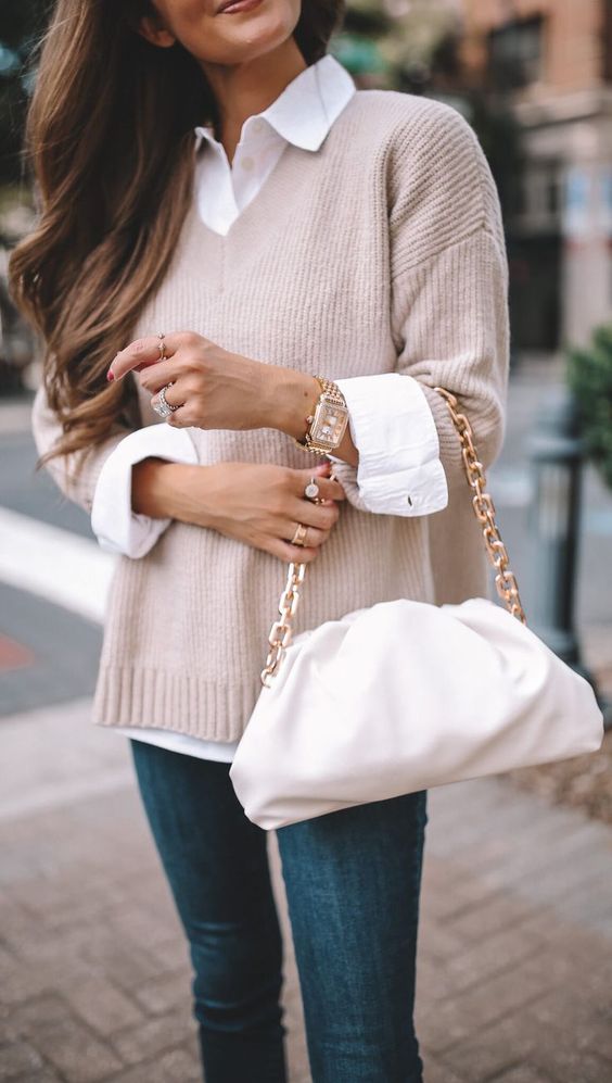 White shirt layered with a sweater.