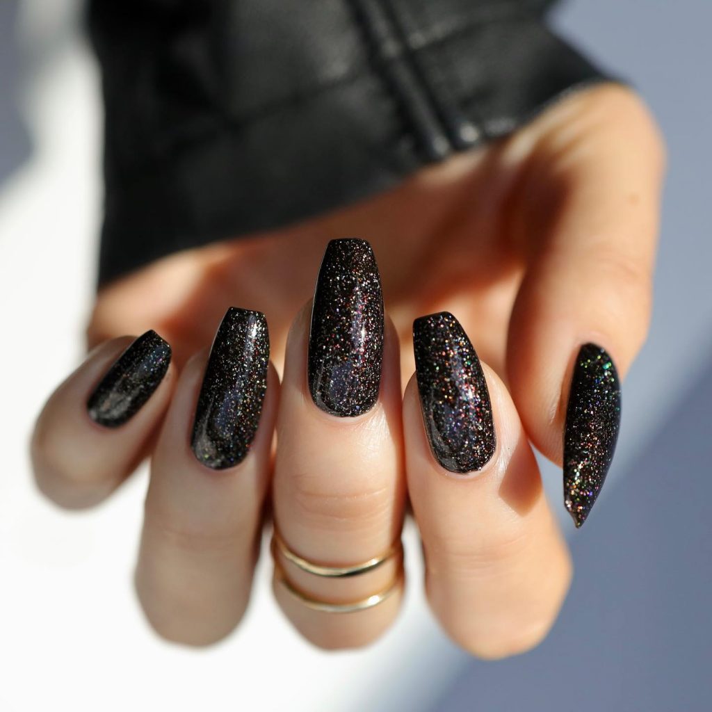 Party-ready black coffin nails with shimmer.