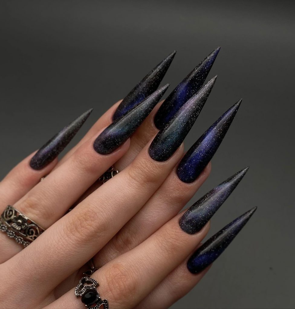 Night-sky inspired nails for a fun party.