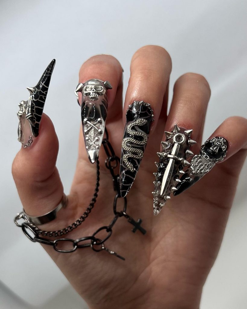 Gothic-inspired black nails for a unique party look.