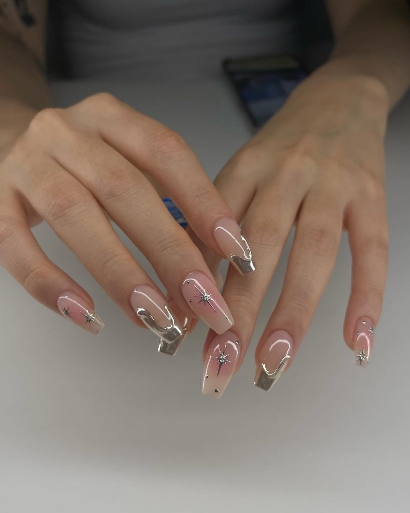 Clear nude nails with silver chrome details.