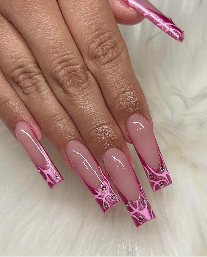 Whimsical pink glittery fantasy on acrylic nails.