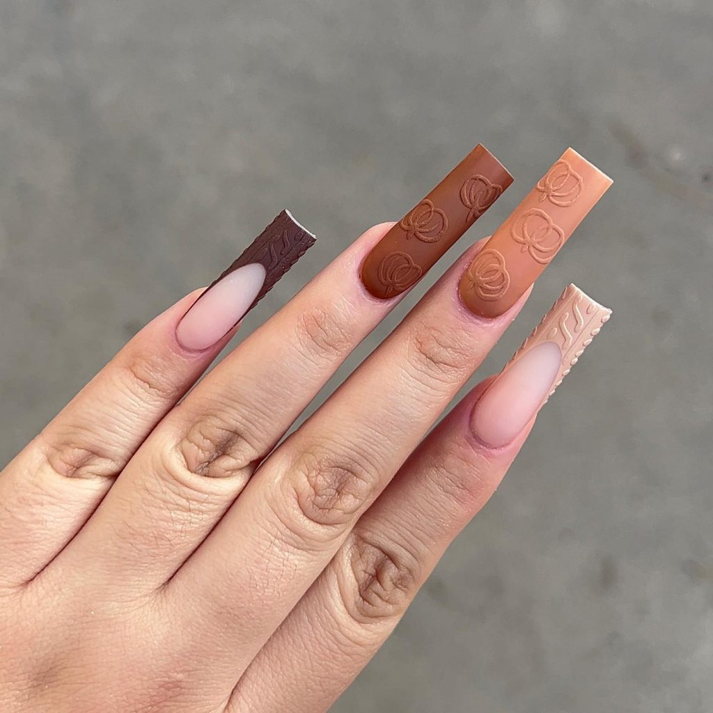 Matte square nude nails, various tan shades.
