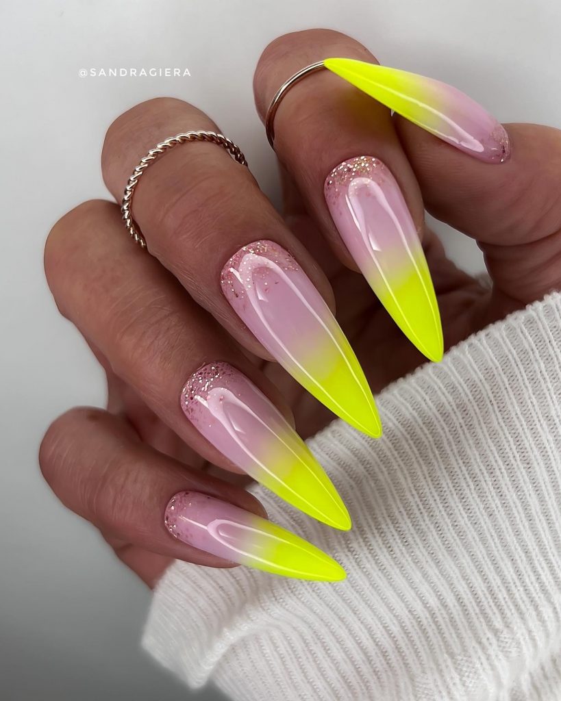 Vibrant neon stiletto radiance on acrylic nails.