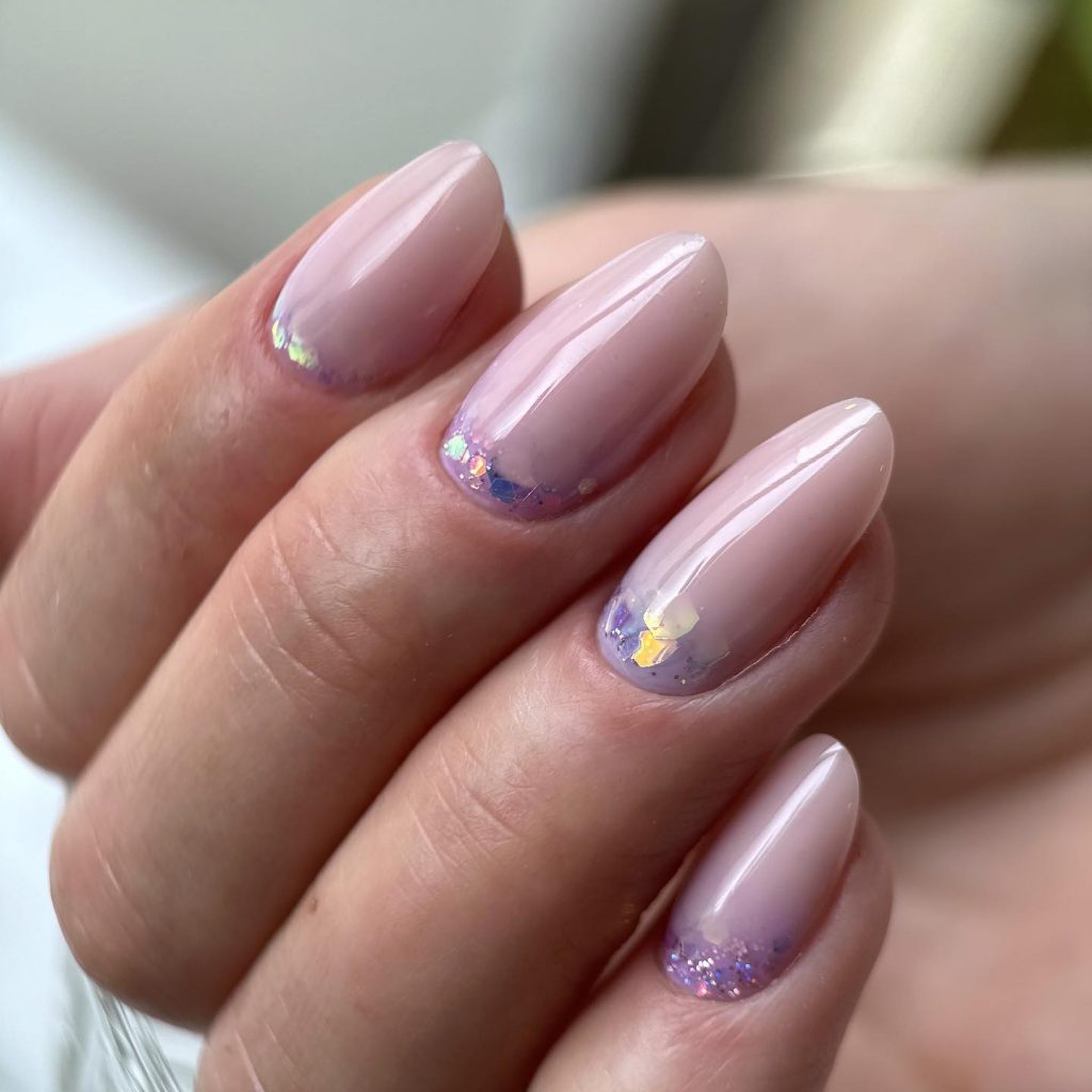 Ombre almond with purple glitter.
