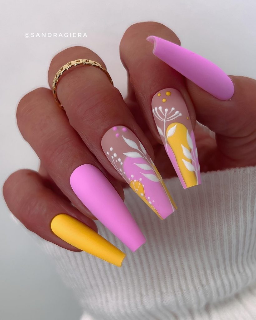Pastel floral burst on acrylic coffin nails.