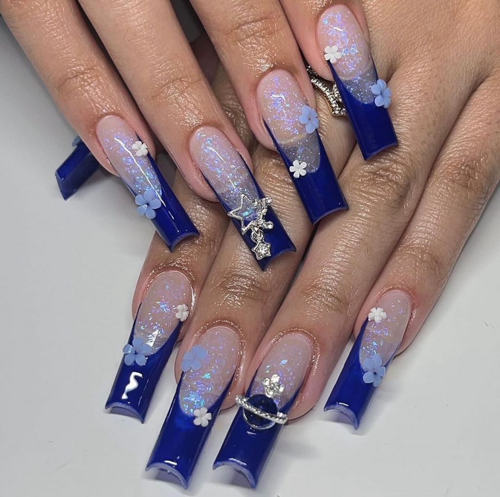 Sparkling blue French brilliance on acrylic nails.