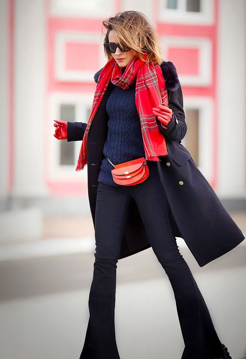 a woman wearing red scarf, bag, gloves with fall outfit