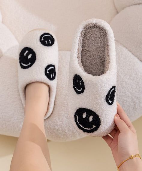 Cozy and cheerful multi happy face slippers.