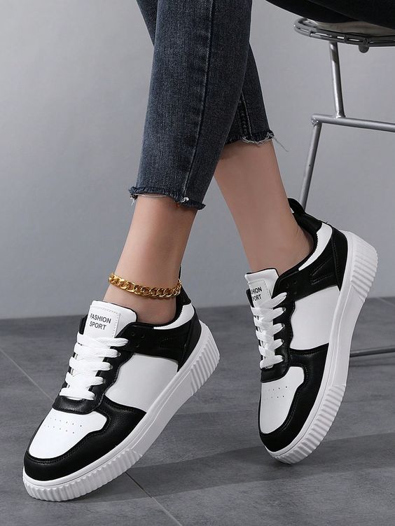 Sporty outdoor sneakers with two-tone lace-up front.