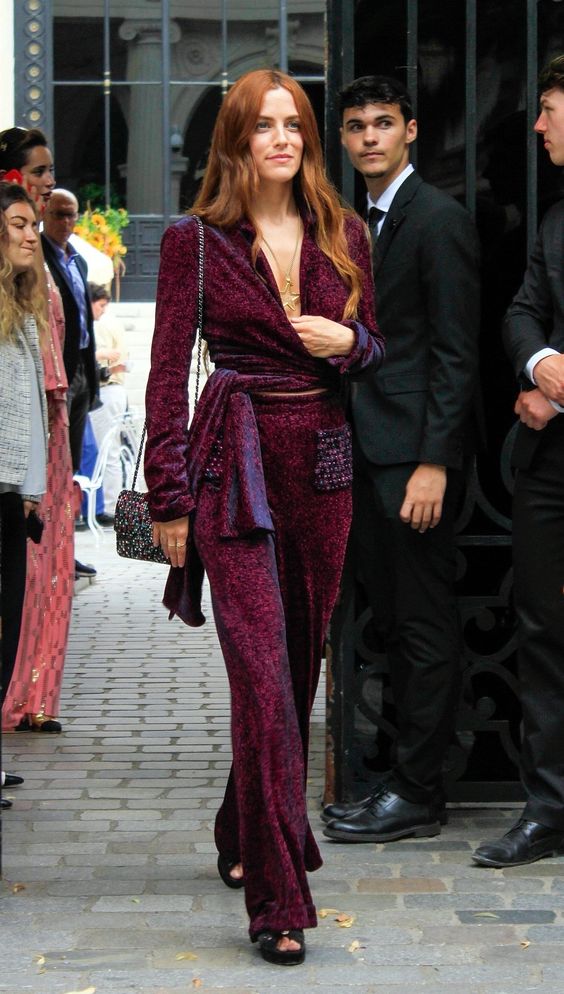 Glamorous maroon jumpsuit, a showstopper for a concert.