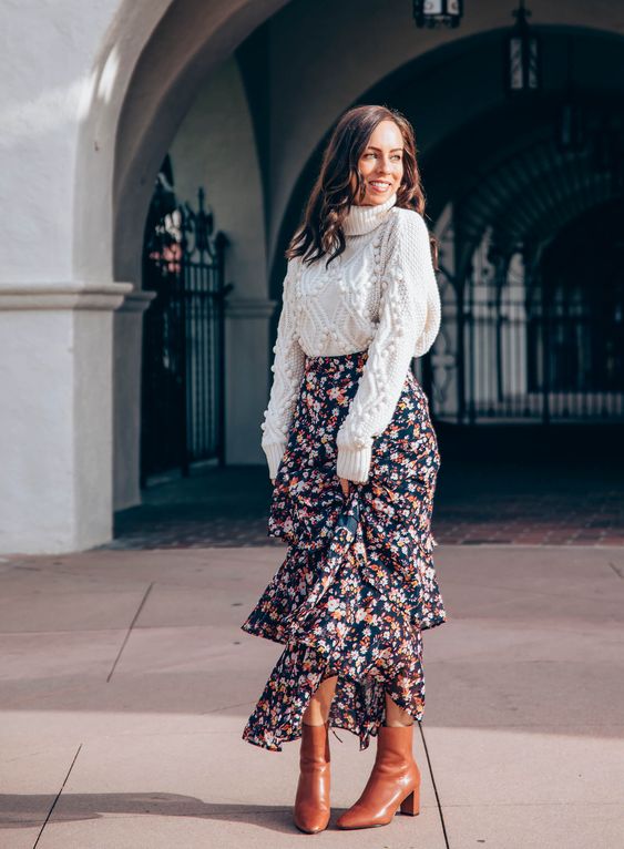 chunky turtleneck sweater and floral skirt.