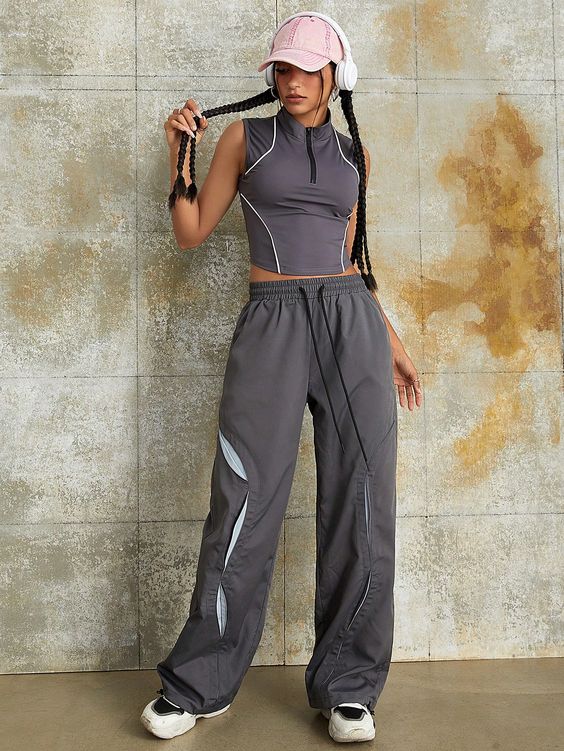 Playful Y2K-inspired ensemble with a front zipper two-tone trim tank top and wide-leg cargo pants.