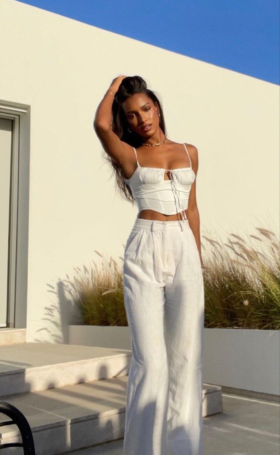 white top and trousers