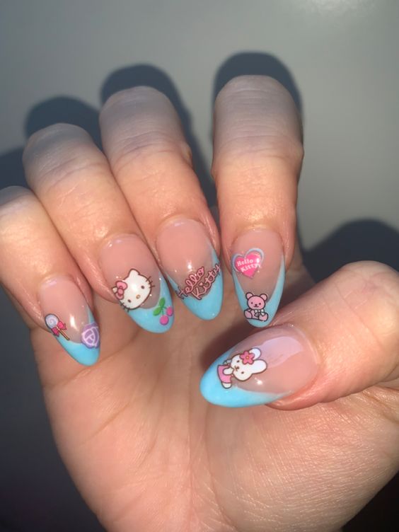 blue accented kitty nails with almond tips
