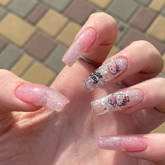 long glitter manicure with Kitty decal