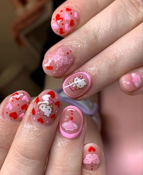 oval hello kitty nails with heart detailing 