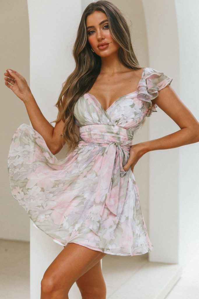 Fun floral pink engagement party outfits for guests with ruffles