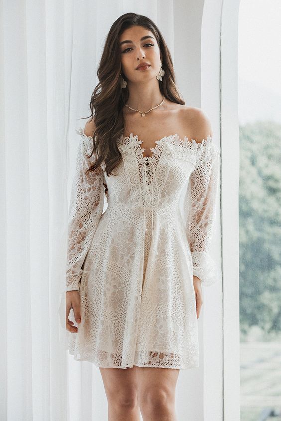 White lace dress with elegant off-the-shoulder sleeves