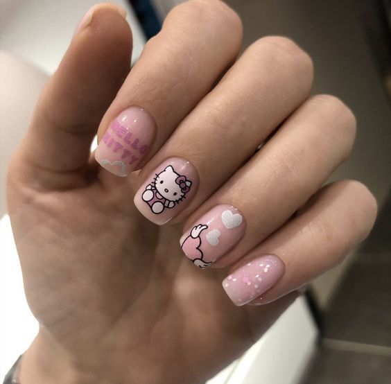 squoval pink gel polish with Kitty detailing 
