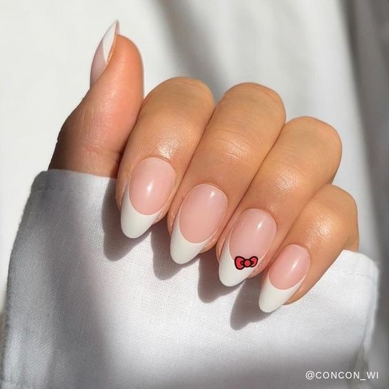 simple gel manicure with Hello Kitty bow design
