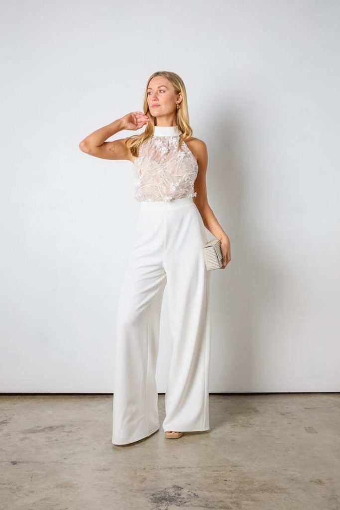 Sleeveless jumpsuit with a floral pattern and mesh overlay