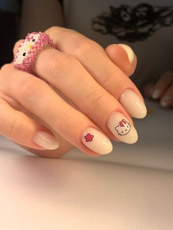 pearl white gel manicure with Hello Kitty stickers
